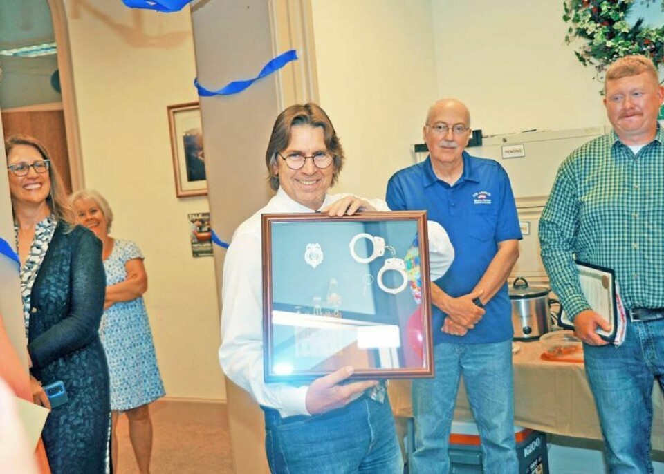 Wayne County Juvenile Court probation officer Mark Russell was presented with a shadowbox and a proclamation from commissioners Ron Amstutz and Jonathan Hofstetter for his retirement after 32 years of service to the county as a juvenile probation officer. Russell retires after 32 years as juvenile probation officer