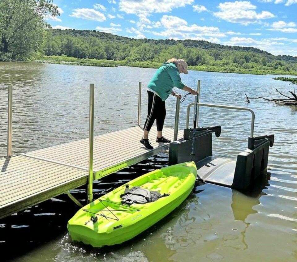 Sherrie Baughman tries out the new kayak launch at the Zoar Wetland Arboretum. Find your treasures at the Zoar Wetland garage sale