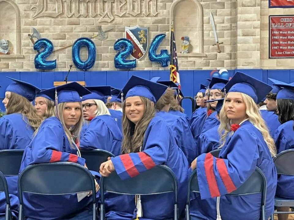 West Holmes seniors Hannah Wolfe, left, Kali Woods and Kenzie Woods take in a musical performance as one of their final moments together as West Holmes Knights. Night to remember for graduating Knights