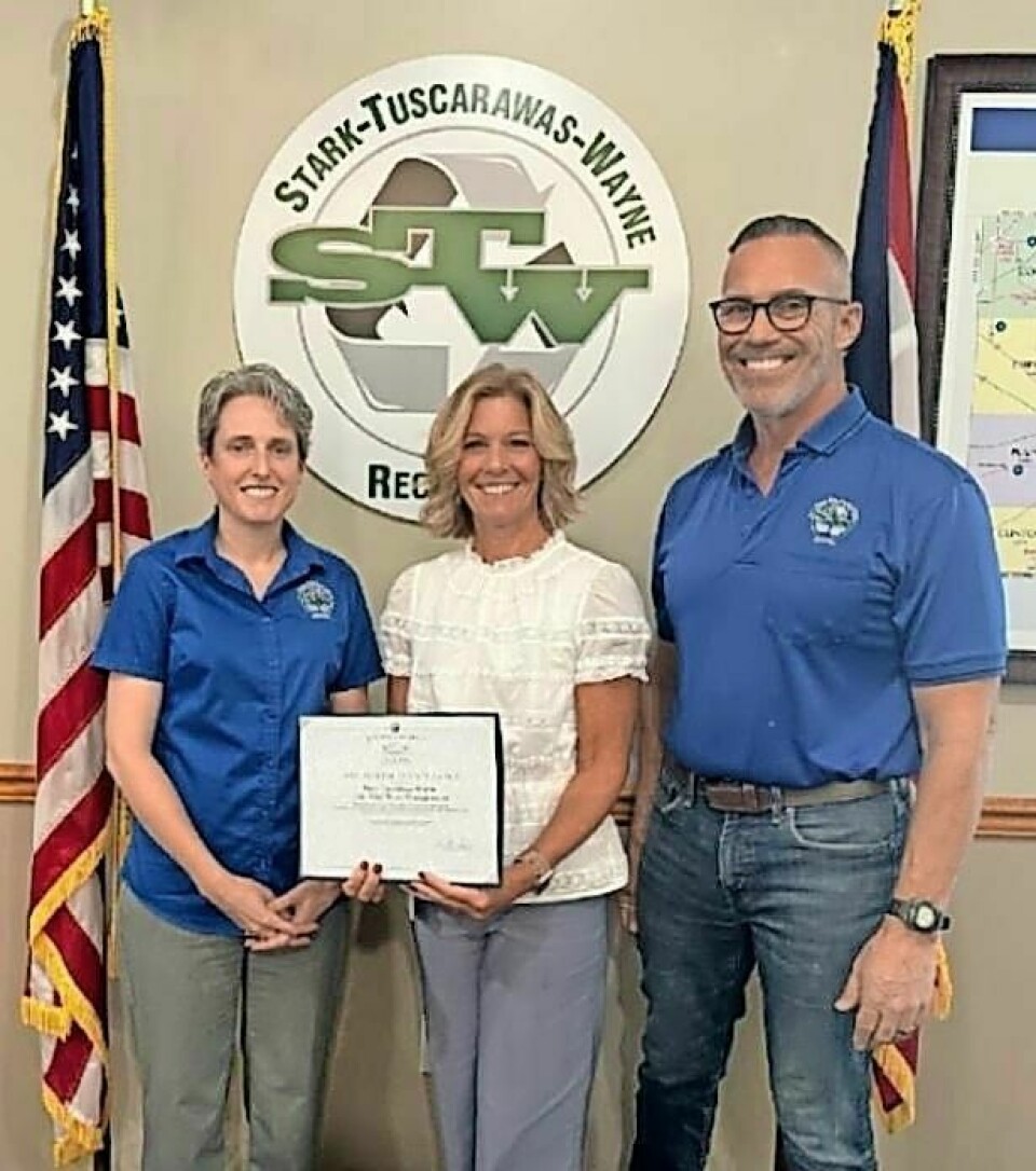 Eric Wright, STW District finance director, left; Jen Drlik, east regional liaison for the Auditor of State's Office; and David Held, STW District director, receive an auditors award for a clean audit 14 years in a row. Finance director receives clean audit for 14th year