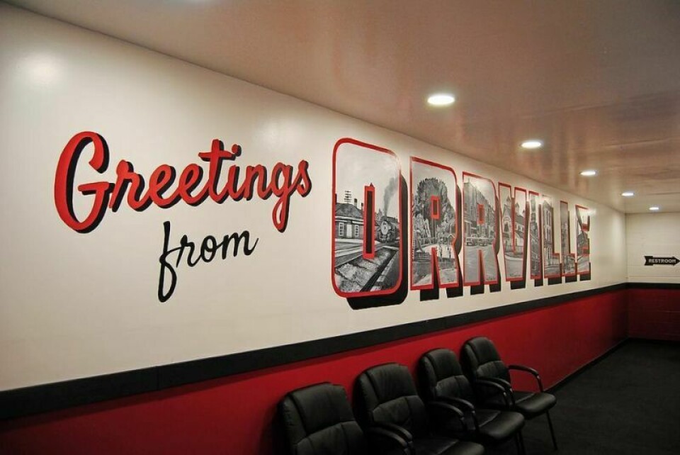 The “Greetings from Orrville” inside the store of Wrench Works, located at 1645 N. Main St. in Orrville, was done by Wadsworth-based artist Abbey Sweigert. Sweigert began the mural, featuring vintage photos of the city, in April and finished it late last month. Mural at Wrench Works pays homage to Orrville’s history