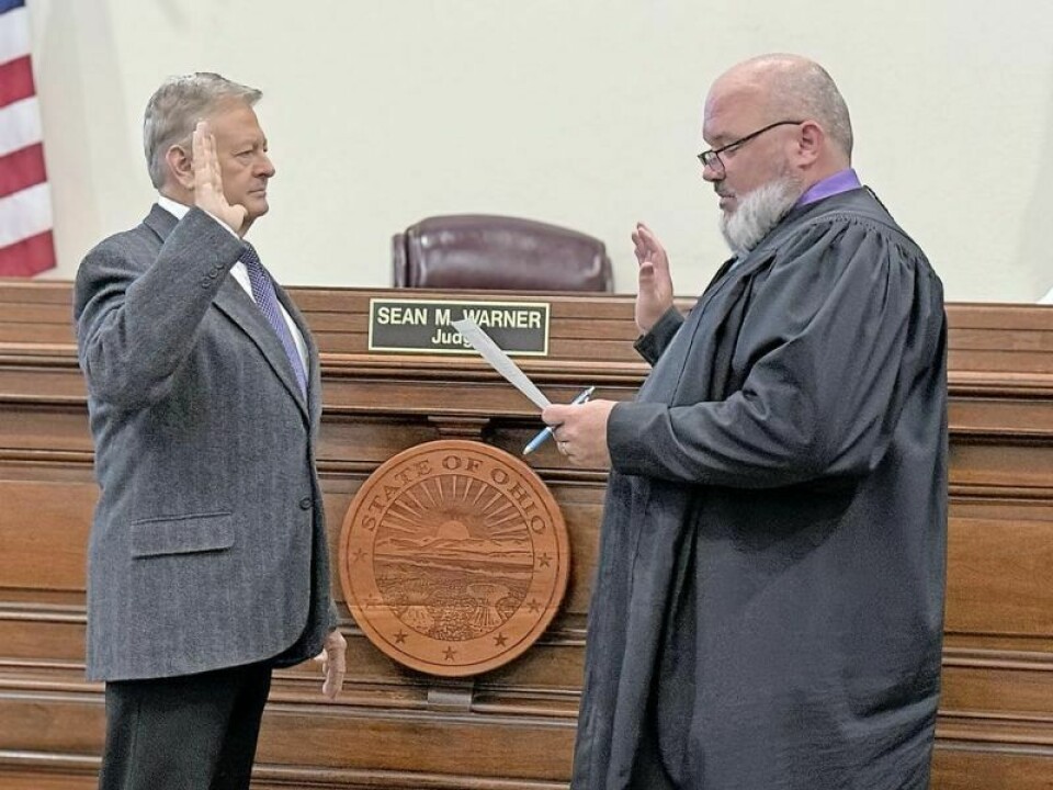 Eric Strouse, left, is sworn in as the newest Holmes County commissioner by Holmes County Judge Sean Warner. Strouse, who earned a seat at the commissioner’s table by winning the primary election and then running unopposed this November, was chosen to fulfill the seat vacated by former Commissioner Ray Eyler, who could not continue due to health issues. Strouse sworn in as new Holmes County commissioner