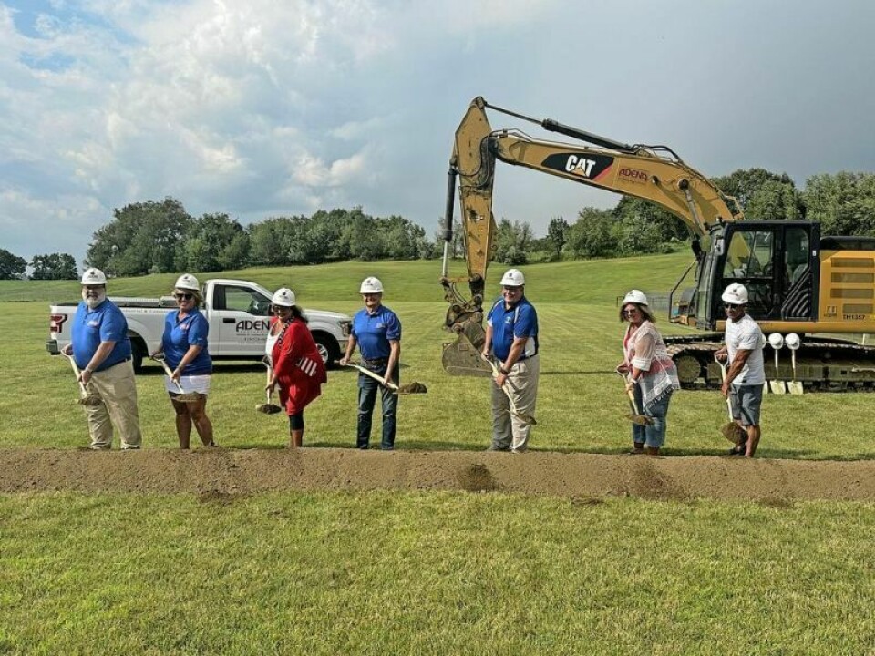 The West Holmes School Board members take their turn at delivering the first shovels full of moving dirt for the excavation of the new K-5 school building on the high school campus. WH Schools digs in for the long run