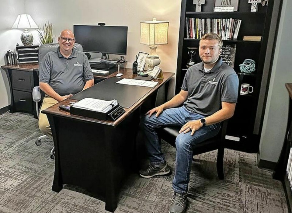 Holmes County Emergency Planning Agency Director Jason Troyer, left, and Assistant Director Jordan Tschiegg relax in their new digs in the Holmes County Health Department building on Glen Drive in Millersburg. They are the first occupants of the new building. HCHD building has first residents in EMA