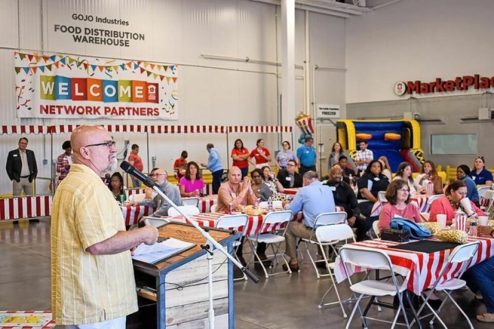 Akron-Canton Regional Foodbank President and CEO Dan Flowers, left, expressed his gratitude to those in attendance at a May 31 celebration for helping the food bank meet its goal of raising the equivalent of 4.2 million meals. Foodbank Harvest for Hunger campaign concludes
