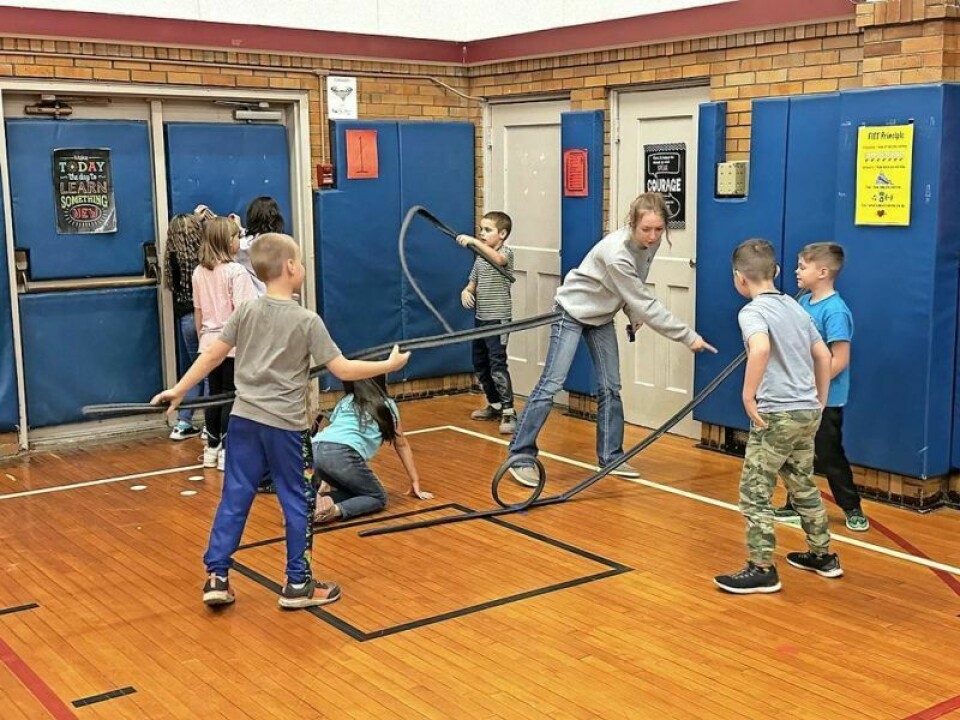 Killbuck third-grade students work with Holmes County 4-Her and Holmes Junior Fair Board member Andi Schuch on the 4-H roller coaster STEM project being promoted by Ella Lorentz of the Holmes County OSU Extension. A 4-H rollercoaster ride to help with STEM learning