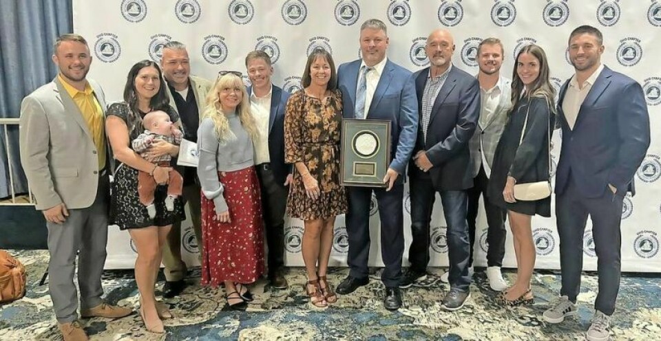 Louie Stanley, with plaque, stands with his wife Lisa; sons Brenden, Reid and Logan; and other family members and friends at the National Wrestling Hall of Fame induction ceremony in Columbus in October. HOF coach says this Bears team could be one of his best