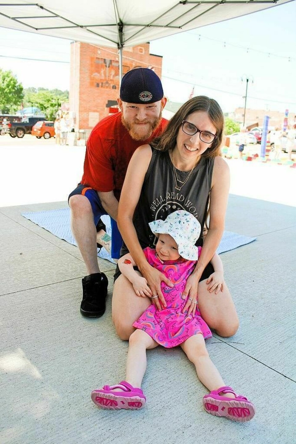 Raven Stevenson, 2, of Uhrichsville can't keep her eyes off her temporary apple tattoo. Raven attended the event with her parents, Matthew and Tanna Stevenson. Claymont summer reading finale engages young readers in fun