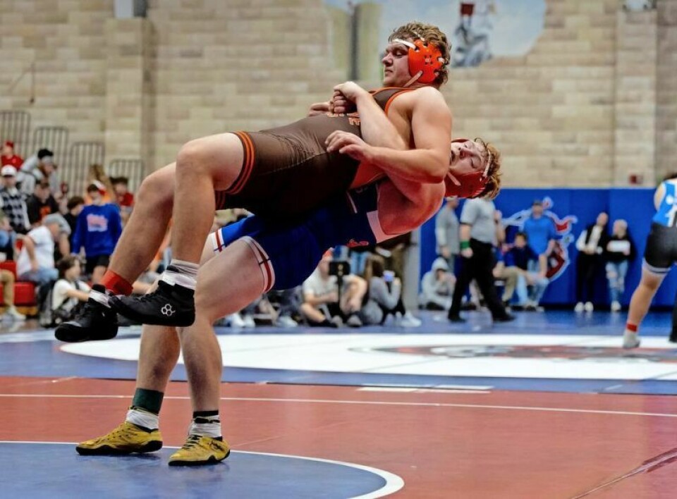 West Holmes senior Grant Miller, bottom, earned his first state berth by finishing third in the 215-pound weight class at the Division II Gallia Academy District on March 2. West Holmes wrestling duo qualifies for state tourney
