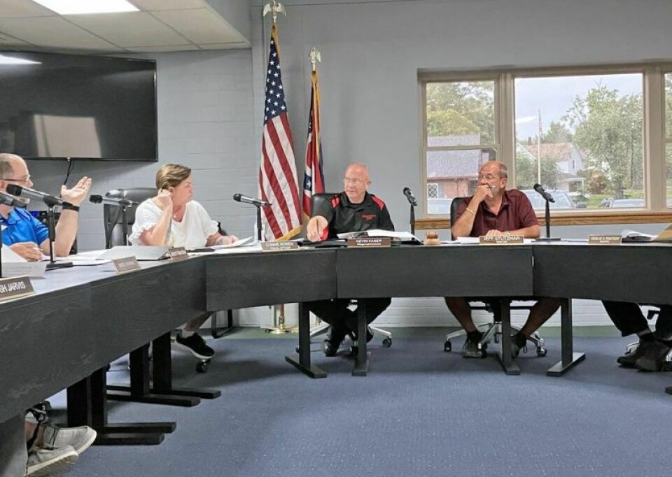 Kevin Kaser, village administrator, and Mayor Jeff Stutzman explain issues to council members. Fire levy won’t increase taxes