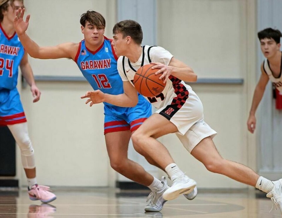 Garaway’s Bronson Speedy (12) and Hiland’s Nick Wigton will continue the spirited rivalry between the Pirates and Hawks. Previewing Holmes area H.S. boys basketball teams