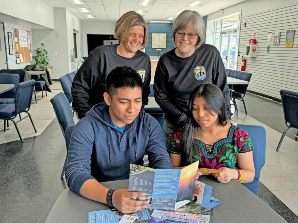 Puentes members Heather Smith and Sherrel Rieger with Gaspar Osorio Raymundo and Yohayra Mejia Agustin. Gaspar is a junior at Dover, and Yohayra is a senior at Buckeye Career Center from Dover. Bilingual job fair creates opportunities for residents