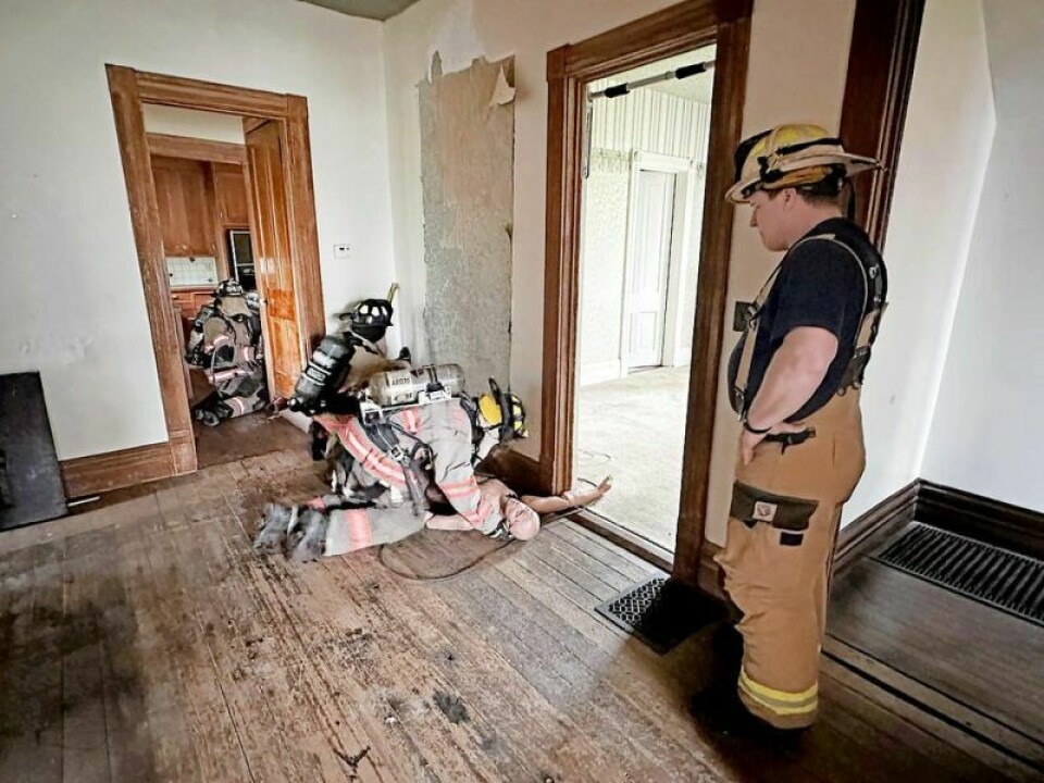 The fire and EMT trainees listen intently as they learn some new tactics in search and rescue operations during the recent fire training session. Sessions at Holmes home provide valuable fire training