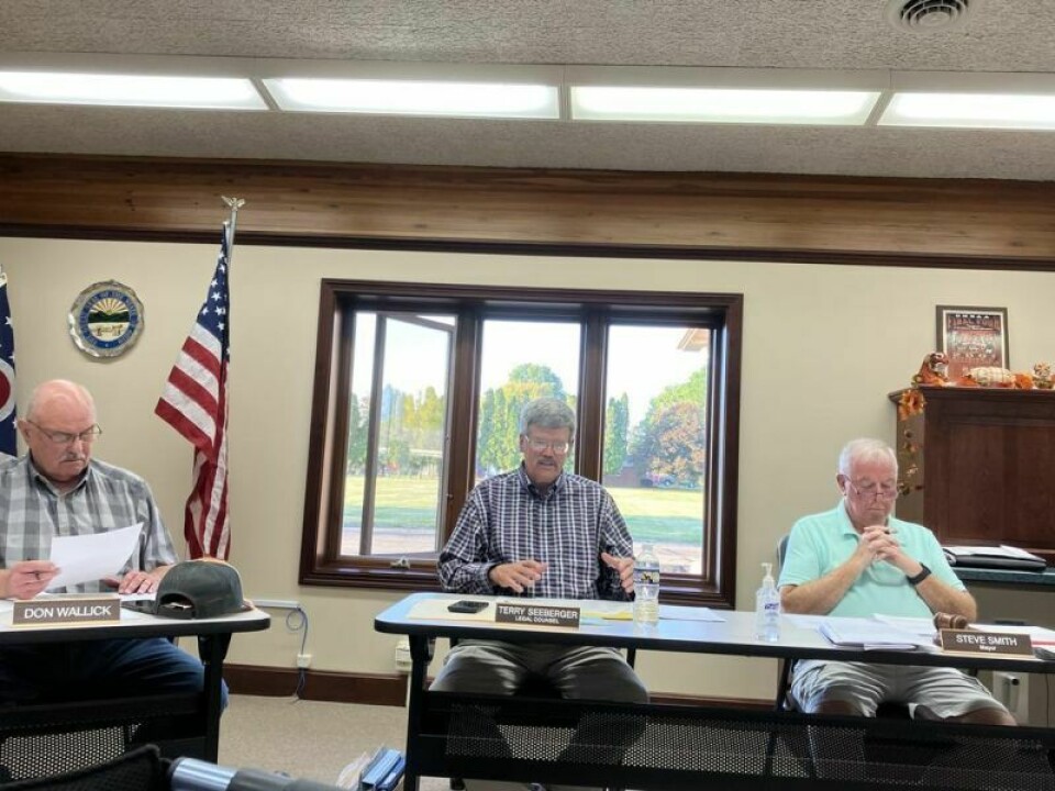 Strasburg Village Council’s Don Wallick, left, Terry Seeberger, law director, and Mayor Steve Smith. Council discussed hiring a school resource officer