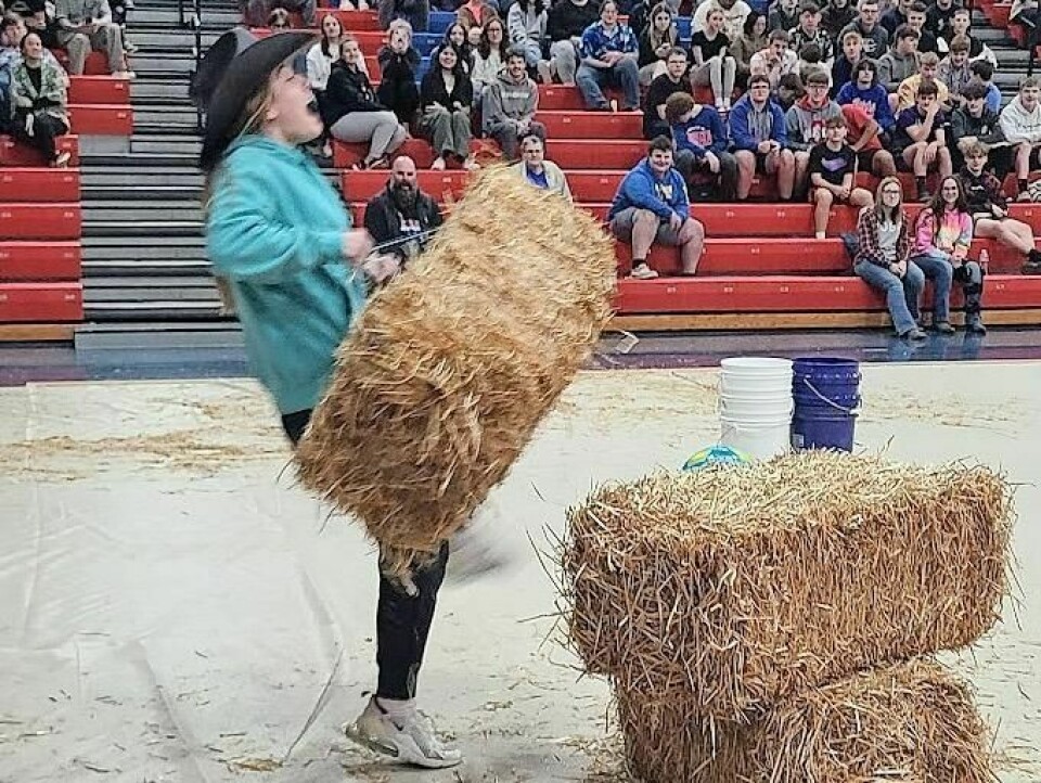 West Holmes student Keegan Uhl participating in the obstacle course during Ag Olympics. West Holmes chapter holds FFA Week