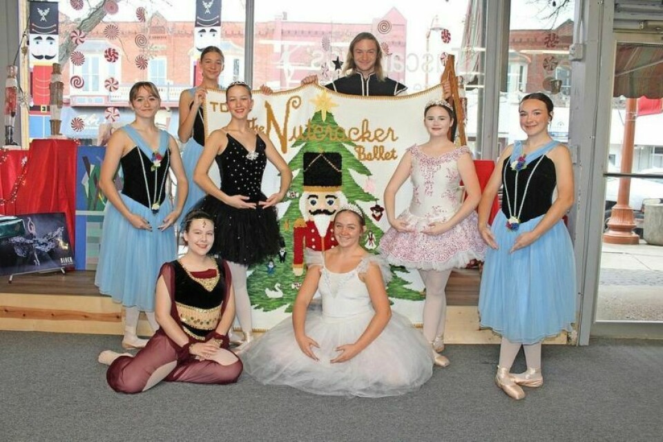 This “Nutcracker” blanket will be raffled off at the last performance of the ballet on Dec. 8.Pictured are Kaylyn Marlatt, top left, and Jameson Marlatt; standing, Lydia Dummermuth, Alyvia McGraw, Laney Lanzer and Sydney Hilton; and sitting, Lydia Warfield and Sierra Minard. Dance students to perform ‘The Nutcracker’