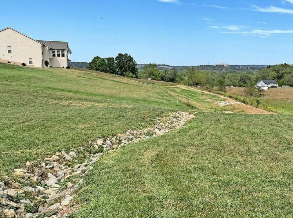 Dry at the moment due to drought conditions, a detention pond never meant to hold water nevertheless does at the Olde Hilltop development. Township seeks assurance from land developer