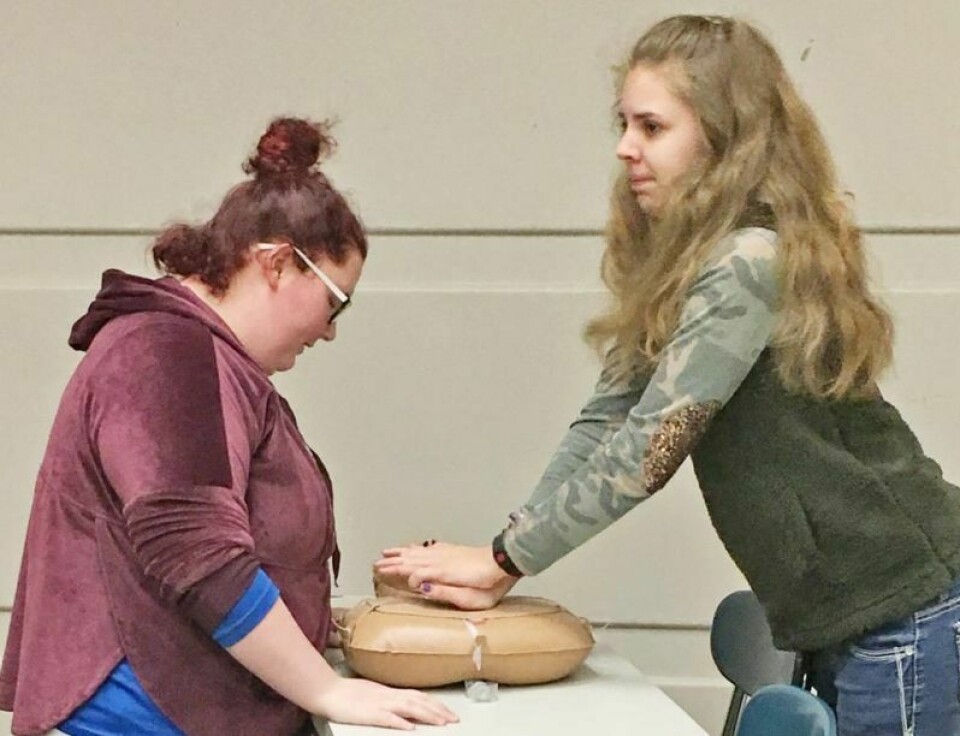 Brianna Smith, left and Eilee Fletcher are Wooster High School students using communication and teamwork to learn how to save a life using CPR at their Work Study meeting. Soft skills help people maintain their positions