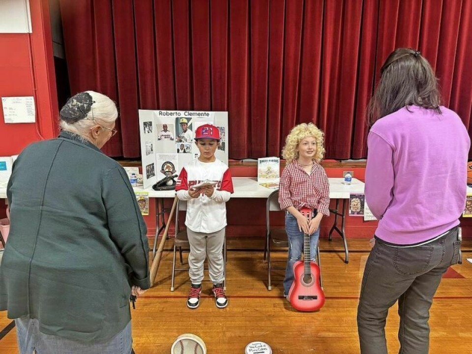 Thomas Miller as Hall of Fame MLB baseball player and humanitarian Roberto Clemente and Alexis Miller as famous singer Dolly Parton come to life during the Walnut Creek Elementary Third Grade Living Wax Museum. World-renowned figures visit Walnut Creek