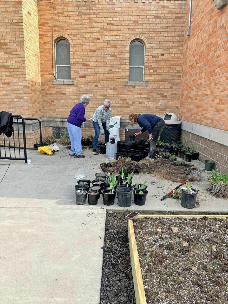 Club members get plants ready for the annual sale at the church. Spring plant sale to be held