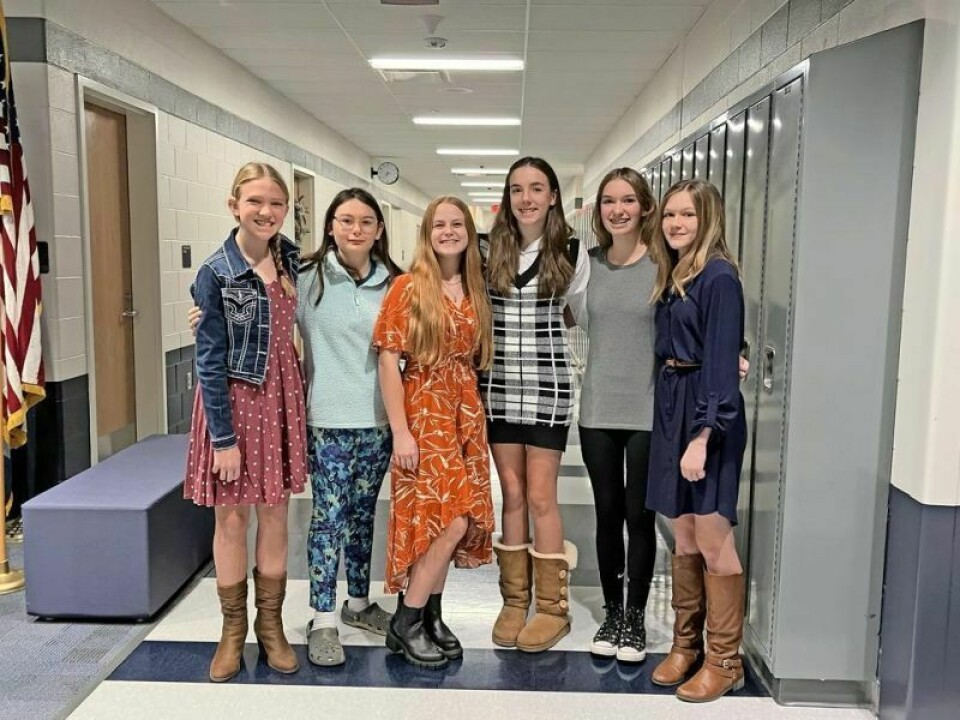 Ila Warstler, left, Adelyn Vigil, Bridget Newtz, Adelyn Peterson, Nova Day and Sylvia Twaddle Board hears presentation from eighth-grade students