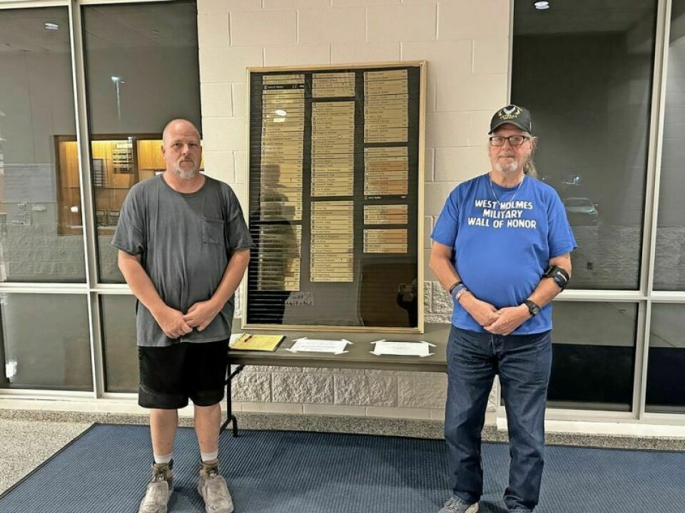 Sean McCune, left, and his father Richard McCune have teamed up to create a pair of tributes to U.S. veterans at the high school and are now in the process of creating a third, a Military Wall of Fame that will include anyone who served who went to West Holmes High School. McCunes working on next WHHS military wall display