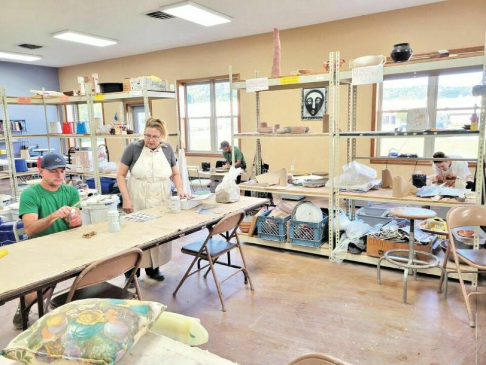 Dee Grossman instructs a student at the Tuscarawas County Center for the Arts. Clay workshops offered at center for the arts
