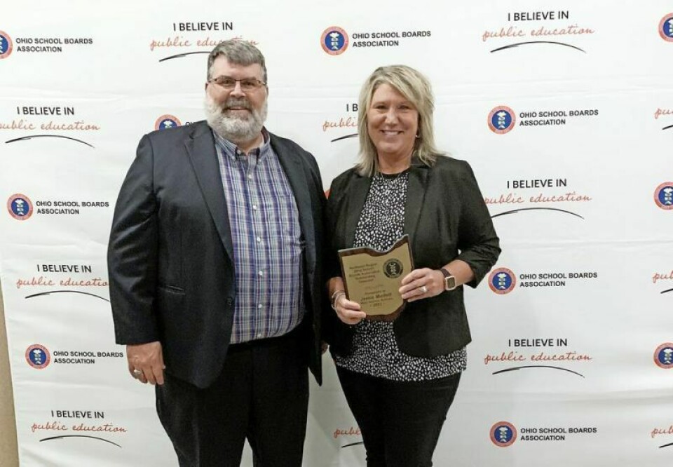 West Holmes Schools Superintendent Eric Jurkovic, left, joins district treasurer Jamie Mullet after Mullet was honored as the recipient of the 2023 Outstanding Treasurer for the Northeast Region. WH’s Mullet honored by OSBA