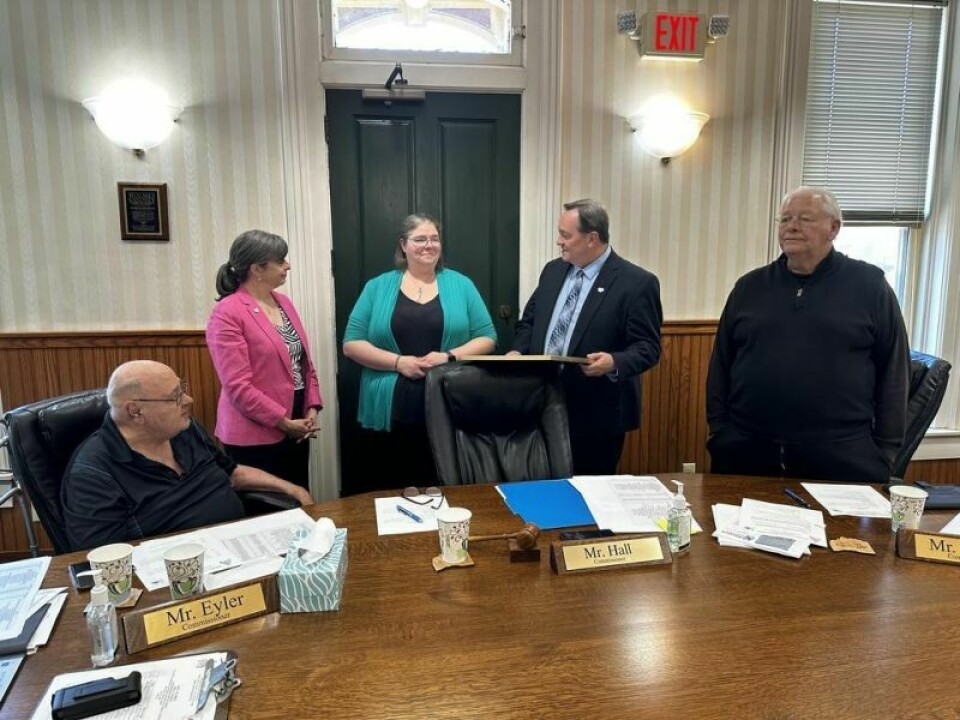 Leaders from County Commissioner’s Association of Ohio stopped by the weekly Holmes County commissioner meeting on Monday, May 13 to present the commissioners with a framed courthouse photo commemorating the county’s bicentennial. The discussion included commissioner Ray Eyler, left, CCAO Director Cheryl Subler, Holmes County bicentennial celebration chair Melissa Patrick, and commissioners Dave Hall and Joe Miller. CCAO honors Holmes County during its bicentennial