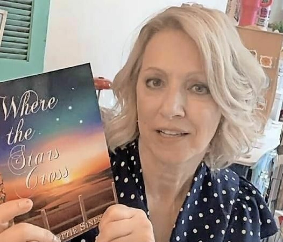 Wooster author Dottie Sines holds a copy of “Where the Stars Cross,” a novel that is set to be released worldwide on Sept. 11. Novel by local author set for worldwide release