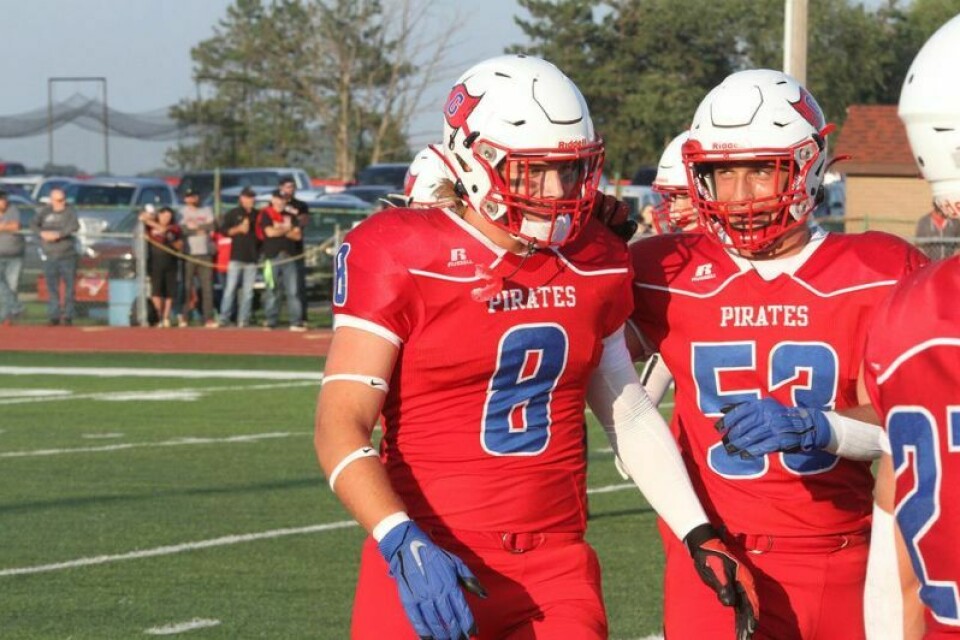 Fellow Pirates’ defender Clayton Downs, 53, congratulates Jackson Reifenschneider following his third sack of the first quarter. After illness kept the Garaway senior out of commission the past two seasons, he returned to the game with a vengeance. Reifenschneider’s awesome opening night an inspiring story