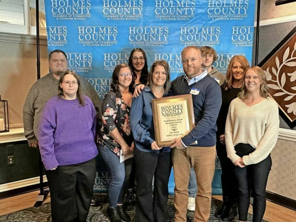 Shoemaker Custom Apparel owners Tyler and Tabitha Shoemaker, holding award, and their staff accepted the 2023 Holmes County Chamber of Commerce and Tourism Bureau’s annual Small Business of the Year at this year’s banquet. Holmes Chamber honoree prints a winning formula