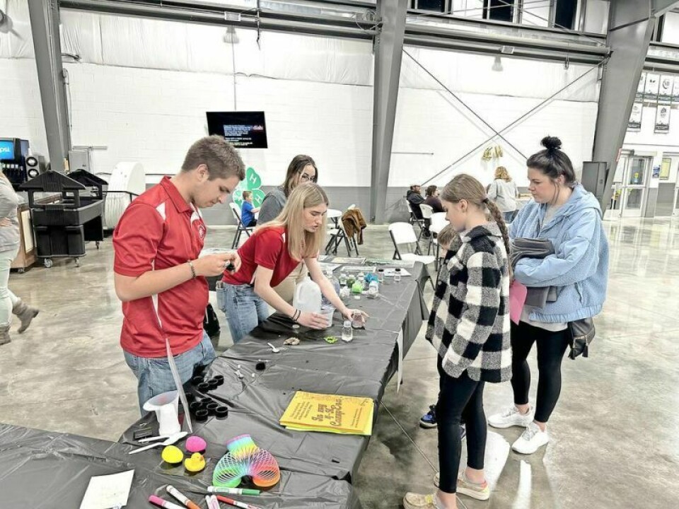 Tristan Houin, left, Maren Drzazga and Madison Pearce-Laferty set up camp at the Ohio State 4-H table. The current crop of Holmes County Junior Fair Board members were promoting the fun and benefits of joining 4-H at the recent open house at Harvest Ridge. Holmes Co. 4-H Open House a sneak peek into excitement