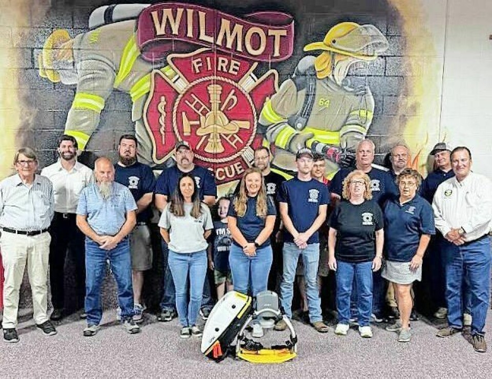 Dan Schwartz, front left, Rick Patterson, Amanda Weaver, Katey Alloway, Ben Yeakley, Frances Miller, Sue Scheetz, Stark County commissioner Richard Regula; back row, salesman Brandon Bucker, Greg Hostetler, Capt. Brandon McCune, Caleb Hostetler, Bill Warstler, Aaron Black and Jim Hall Wilmot Fire Department received a grant