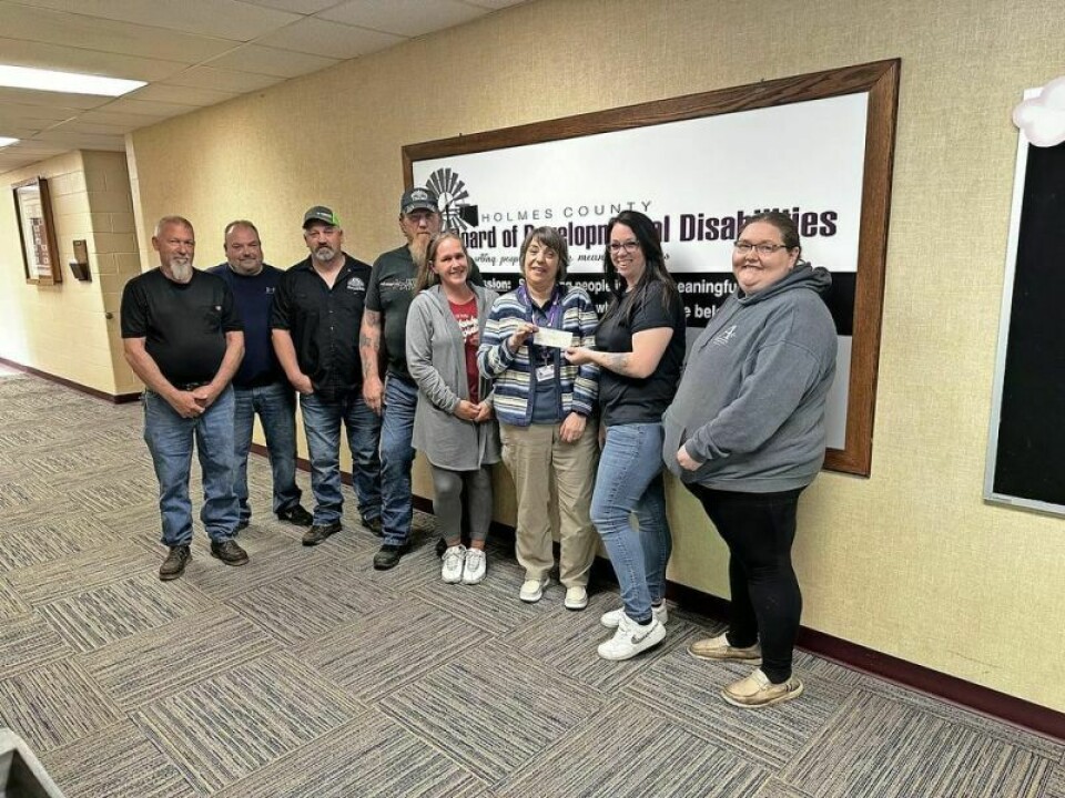 On Wednesday, May 15, members of the Holmes Conservation Beagle Club presented a $1,200 check to Holmes County Board of Development Disabilities Superintendent Marianne Mader, center. Included were club trustees Bill Geib, left, Austin Thomas and Raymond Miller; President Scott Fluhart; trustee Karen Fluhart; Mader; secretary Ashley Fluhart; and trustee Elizabeth Strouse. Holmes Conservation Beagle Club rides for Morris, HCBDD