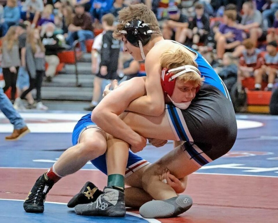 West Holmes' Louden Dixon, left, won the 144-pound title at the Ohio Cardinal Conference Tournament on Feb. 17. The sophomore was voted Wrestler of the Year by the conference's coaches. Knights third at OCC tourney; Dixon named top wrestler