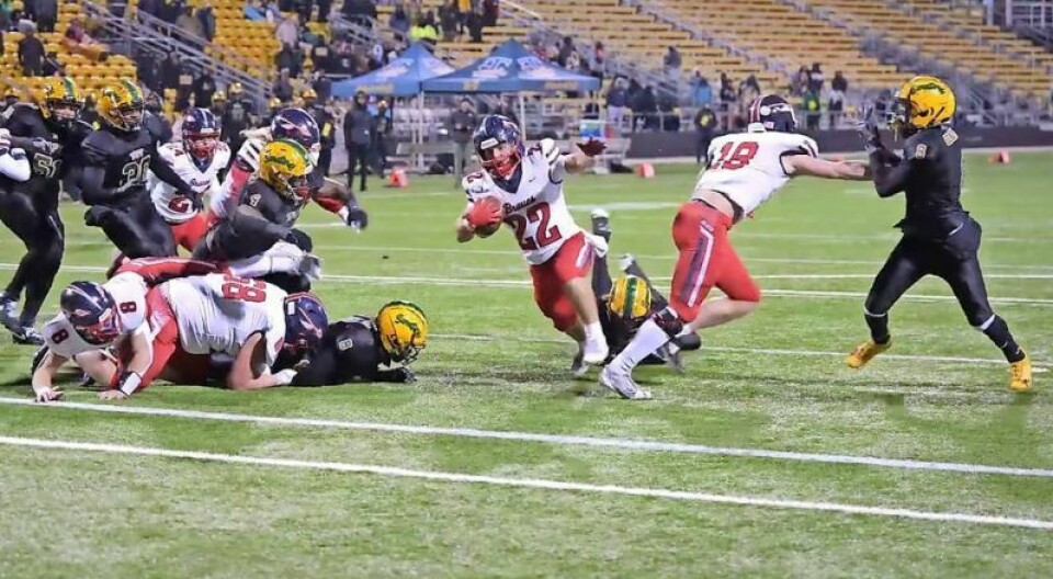 Indian Valley running back Grady Kinsey (22) breaks through the line for some of his 171 rushing yards in the Braves' Division IV state semifinal football game on Nov. 29 against Cincinnati Taft at Historic Crew Stadium in Columbus. Indian Valley scored the game's final 21 points to rally for a 29-20 victory, improve to 15-0 and advance to the state championship game on Dec. 7 at 7:30 p.m. against 14-1 Sandusky Perkins at Canton's Tom Benson Stadium. 15-0 Braves march into state title game