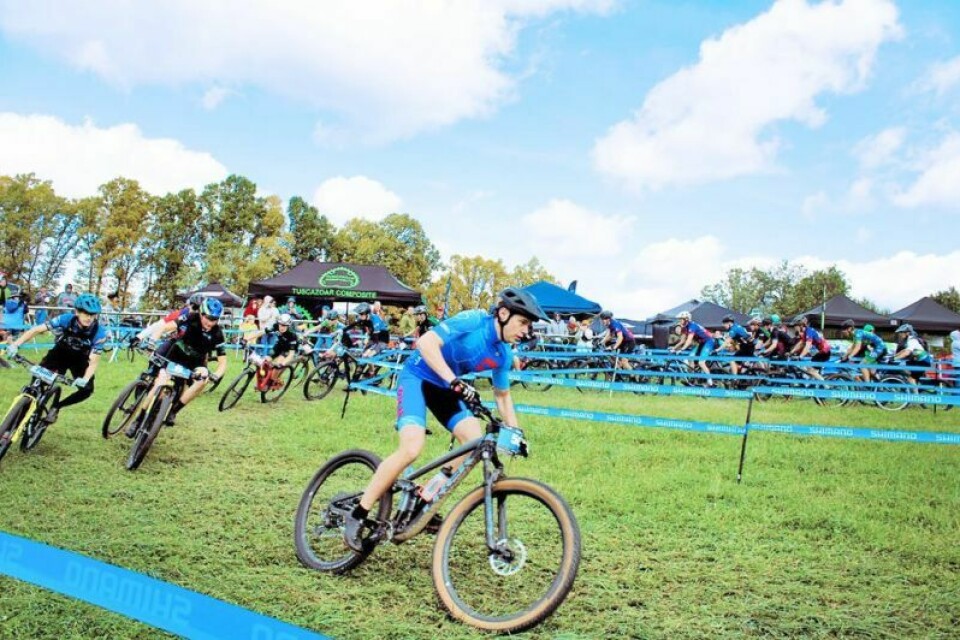 The first turn in the high school boys race Mountain bike races held at Camp Tuscazoar