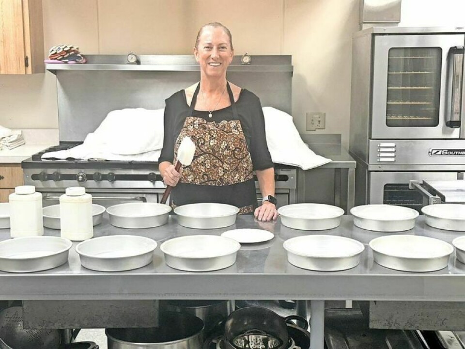 Lorrigan Booth prepares sugar cakes for baking. Church continues to provide tasty Moravian sugar cake