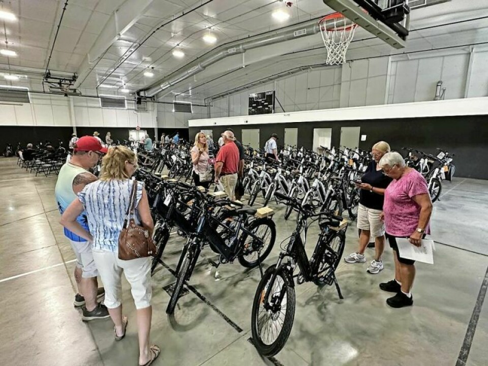 People from both near and far made the trek to Winesburg to peruse and then bid on the more than 230 E-bikes that were part of an auction on June 18. Local E-bike auction draws an eclectic crowd