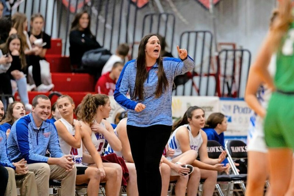 West Holmes coach Lindsy Belden shouts instructions to her players during their Classic in the Country game against Margaretta. WHHS girls hoops responds to adversity during CitC