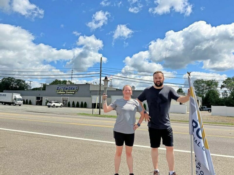 Police Cpls. Kayla Morrison, left, and Connor Bailey Police participate in Torch Run for Special Olympics