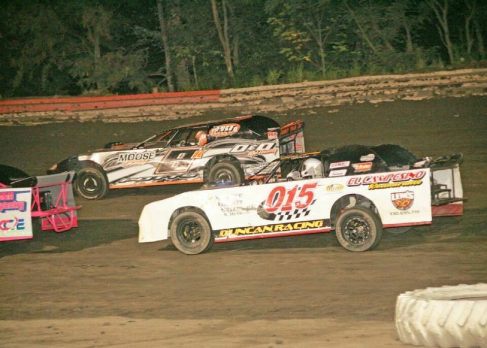 Logan Duncan (015) and Kevin Potts duke it out going into a turn at Hilltop Speedway on July 28. Gary Hensel, Jr. went on to win the Street Stock feature, with Potts second and Duncan fourth. Hilltop Speedway honors young fans on Kids Night