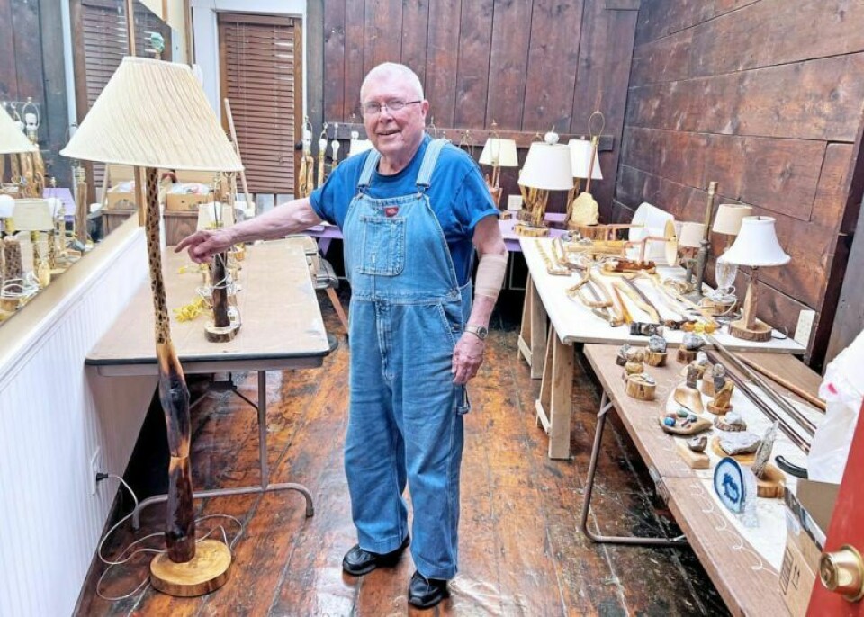 Wooster resident Charlie Mann shows off a floor lamp made of cholla wood and lilac he has on display for sale at Stull’s Barbershop in Wooster. Mann, 89, started making lamps from cholla 10 years ago and hasn’t stopped. ‘Lamp Man’ shows it’s never too late to reinvent yourself
