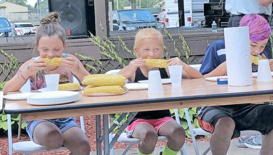 Mya Boylan, left, and Lainey Edwards participated in the corn-eating contest in 2019. Strasburg Summer Festival will still celebrate corn
