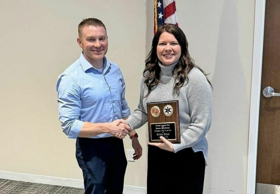 Josh Martell, left, president of the Wayne County Fire & Rescue Association, presents Lt. Kristen Priest of the Wooster Fire Department with the award for 2023 Firefighter/EMT of the Year. WCFRA honors 2023 Firefighter of the Year