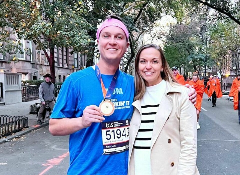 During his run in the recent New York Marathon, Wooster's Tom Furman, left, and wife Amanda also revealed the gender of their upcoming child — a girl. Local man runs NYC Marathon for charity, does gender reveal mid-race