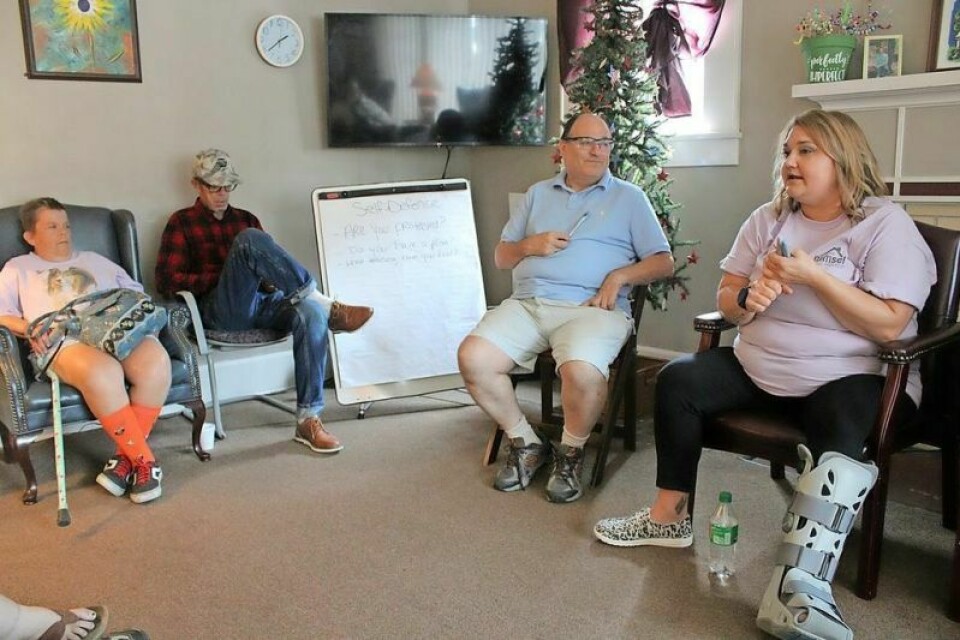 Betsy Walker, program director at ACE Inc., conducts a personal safety class. Seated to her left is Nelson Freed, who helped plan the 30th anniversary open house. ACE Inc. celebrates 30 years of people helping people