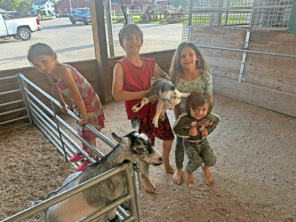 One of the joyful parts of Harvest for Hunger at Hershberger’s Farm & Bakery is families, especially kids, who could venture into the animal farm and cavort with the many animals. Emma, left, Jackson, Sage and Adriana enjoyed connecting with the goats. OFB’s Harvest for Hunger feeds those who feed others