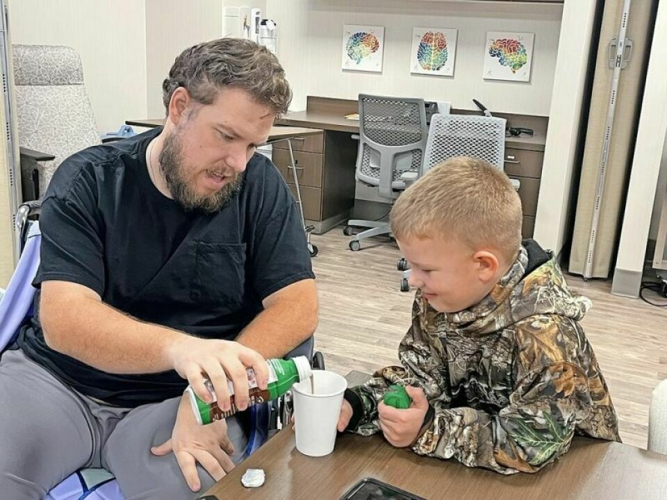Nathan Wheeler and his son Camden share a quiet moment together. It is moments like this that Wheeler said he won't ever take for granted again after a near-fatal hunting accident changed his life in a heartbeat last November. Softball benefit to help Wheeler in 'next chapter'